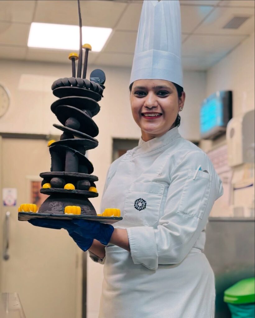 Shalini Singh holding her chocolate showpiece — original photograph